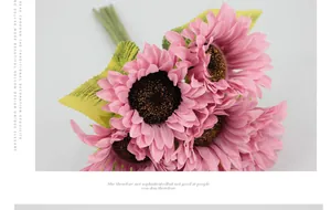 Detailed close-up of pink artificial sunflower bouquet with realistic silk petals and leaves