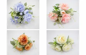 Detailed view of artificial peonies in blue, deep pink, orange, and cream white colors
