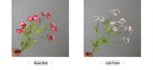 Detail view of artificial rose red and light purple daisies for home wedding decoration