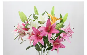 Detail of 3D printed lilies in pink and white with realistic petals and green leaves