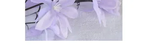 Macro shot of artificial purple silk lilies with delicate white stamens for wedding decor