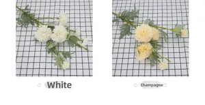 Detailed close-up of artificial dahlia flowers in white and champagne for home decor