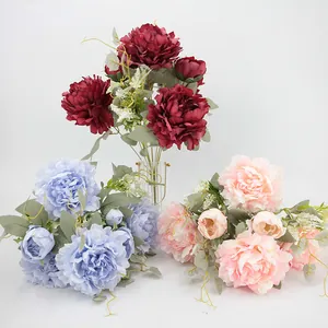 Artificial peony bouquets in burgundy, light blue, and pink for elegant home decoration