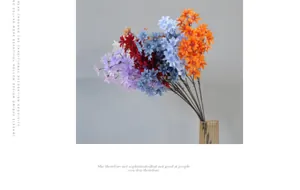Detail of colorful artificial orchid bouquets in a textured glass vase for weddings