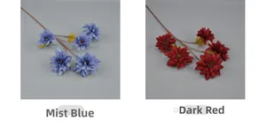 Detail view of multi-layered artificial dahlia flowers in mist blue and dark red shades