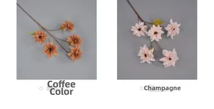 Close-up detail of champagne and coffee artificial dahlia flowers with multi-layered petals
