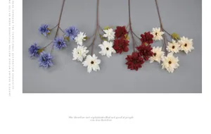 Detailed view of artificial dahlia branches in deep blue, white, burgundy, and champagne