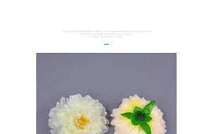 Detailed view of handmade white and yellow artificial peony flower heads for DIY crafts