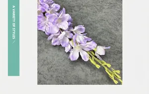 Close-up of artificial delphinium flowers with light purple silk petals and green buds