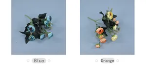 Detail view of artificial rose bouquets in blue and orange for elegant wedding decor