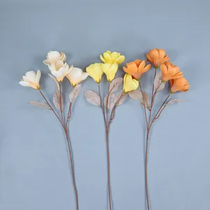 Artificial 4-head magnolia branches in white, yellow, and orange for home floral decor