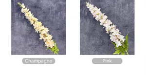 Detail of artificial Delphinium flowers in champagne and pink white gradient tones