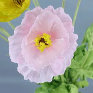 Pink and yellow silk artificial poppy flowers with realistic petals and green stems