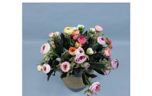 Macro shot of colorful artificial silk roses in a textured ceramic vase for home decor