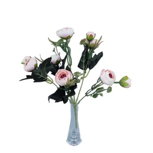 Artificial pink rose bouquet in striped glass vase for home wedding decoration