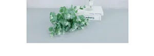 Close-up of 16-fork artificial eucalyptus leaves with realistic grey-green texture for decor