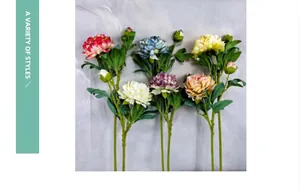 Detailed macro view showing diverse colors and textures of artificial silk peony flowers