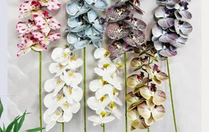 Detailed view showing variety of artificial phalaenopsis orchids with realistic petals
