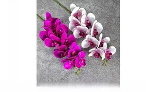Detail of lifelike artificial magenta and white purple-spotted phalaenopsis orchids