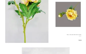 Macro detail of artificial yellow peony with silk petals and realistic green leaves