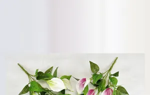 Macro shot of 5-head PU calla lilies showing realistic petals and green leaves