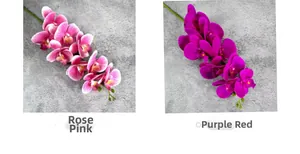 Detail of rosy pink and purple red artificial orchids showing realistic petal textures