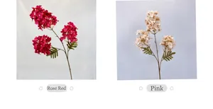 Detail view of artificial hydrangea with three flower heads in rose red and pink colors