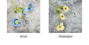 Detail of blue and champagne silk poppy flowers with flocked stems for home decor