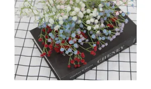 Detail of colorful artificial gypsophila bouquets in white, blue, red and pink shades