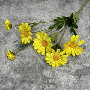 Artificial 6-head yellow daisies bouquet for home decor on gray stone background
