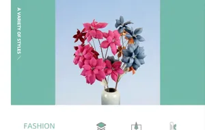 Vibrant magenta and muted blue artificial flowers in a round grey ceramic vase