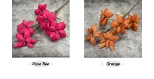 Detailed comparison of artificial rose red and orange magnolia flowers with multi-layer petals