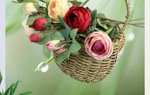 Close-up of artificial roses in a woven hanging basket for home and wedding decor