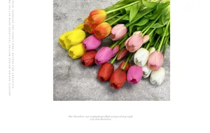 Detailed view of colorful faux tulips with realistic texture on a stone background