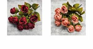 Detail view of artificial peony silk roses in dark red and coral shades for home decor
