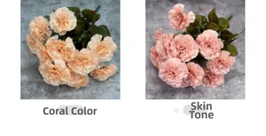 Detail view of artificial carnation bouquets in coral and nude tones with green leaves