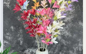 Vibrant multi-color silk lilies in a minimalist white ceramic vase for home decor