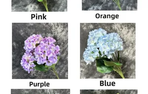 Detail of faux hydrangeas in pink, orange, purple, and blue with realistic green leaves