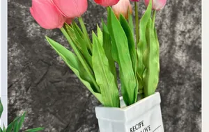 Realistic colorful PU tulips in creative white ceramic vase on dark textured background