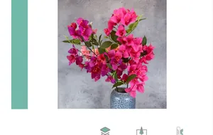 Macro detail of silk bougainvillea flowers in pink and rose in a blue ceramic vase