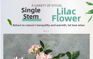 Detail of single stem artificial lilac flower with realistic pink silk petals and green leaves