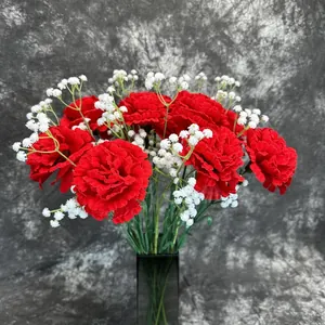 Red carnation artificial flower set with gypsophila in a black glass vase for home decor
