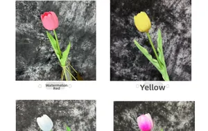 Macro detail of artificial PU tulips in watermelon red and yellow for home decor