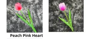 Detail view of pink and purple artificial PU tulips with realistic texture and green leaves