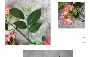 Detail of pink silk hydrangea petals and lush green leaves for wedding decor