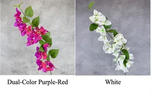 Detail of silk bougainvillea branches in magenta and white with realistic green leaves