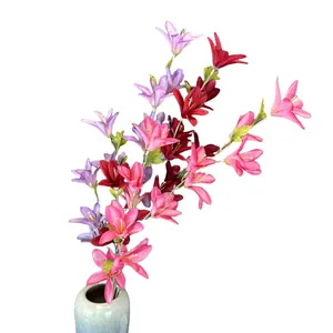 Artificial lily bouquet in pink and purple tones within a ceramic vase for home decor