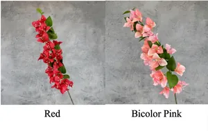 Detail of red and bicolor pink artificial bougainvillea branches with green leaves