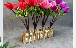 Artificial cyclamen potted plants in red and purple colors with heart-shaped leaves