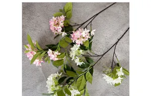 Close-up of pink and white silk hydrangea clusters with realistic green leaves and stems